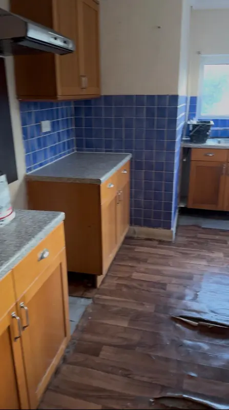 Old wooden kitchen with blue tiles before the refit