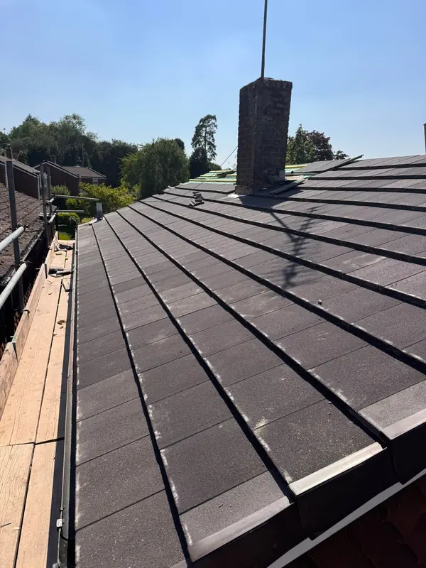 New roof tiles running up to the chimney stack