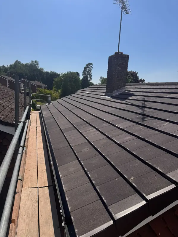 New roof tiles seen from the scaffold walkway