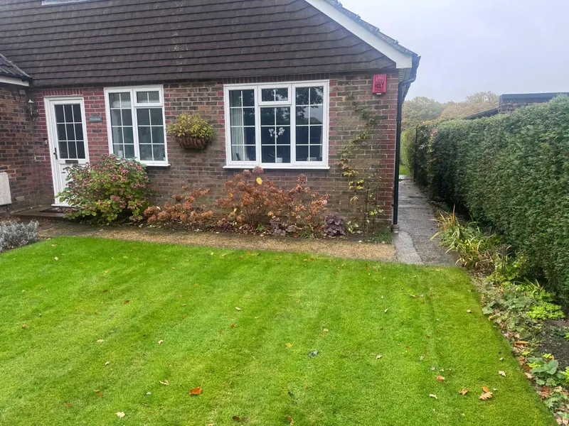Back of a bungalow with lawn before the patio was laid